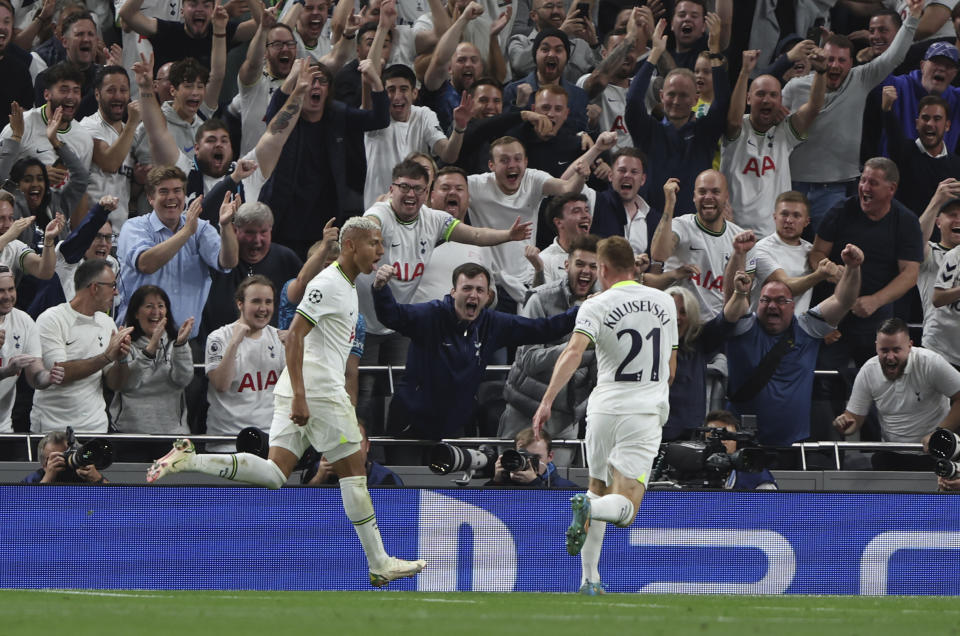 Tottenham's Richarlison, left, celebrates after scoring his side's second goal during the Champions League soccer match between Tottenham Hotspur and Olympique de Marseille at Tottenham Hotspur stadium, in London, England, Wednesday, Sept. 7, 2022. (AP Photo/Ian Walton)