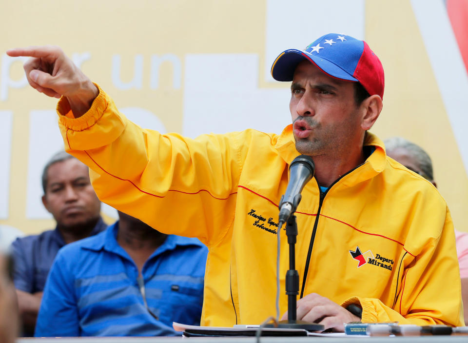 Opposition leader Henrique Capriles speaks during a news conference in Caracas, Venezuela, Sunday, Feb. 16, 2014. Capriles spoke about his solidarity with opposition leader Leopoldo Lopez after Venezuelan security forces raided the homes of Lopez and his parents, looking to arrest the hard-line opposition leader who President Nicolas Maduro blames for three deaths in recent anti-government protests. (AP Photo/Fernando Llano)