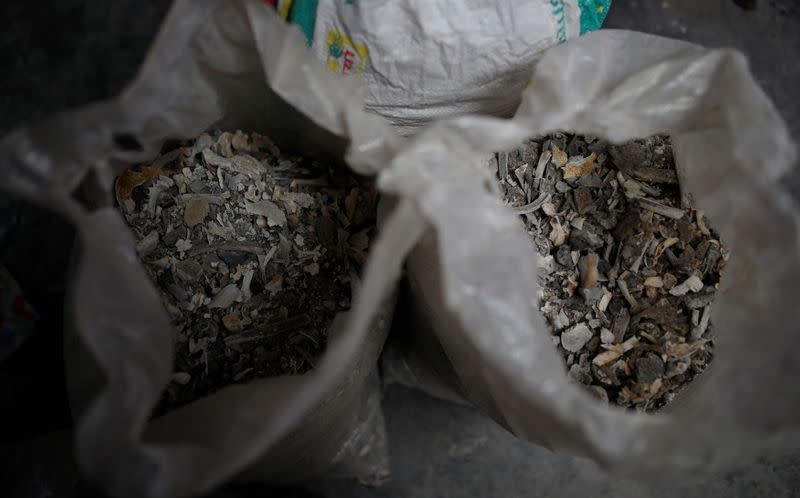 Bags containing unclaimed ashes of victims who died from the coronavirus disease (COVID-19), are seen at a crematorium in New Delhi