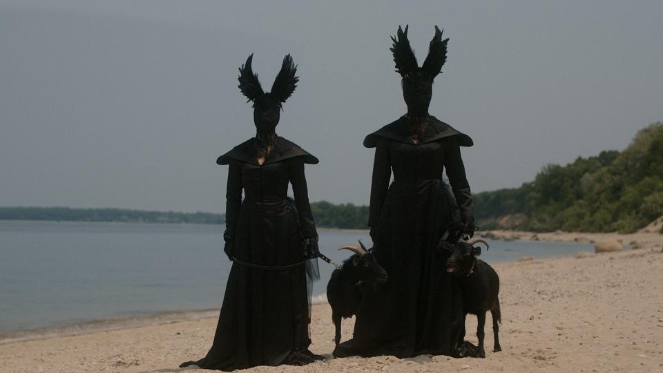 Black cloaked creatures with feather ears in American Horror Story: Delicate