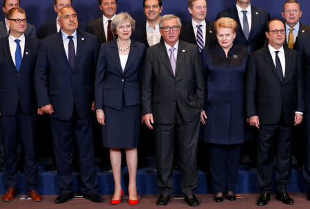 (L-R) Finland's Prime Minister Juha Sipila, Bulgaria's Prime Minister Boyko Borisov, Prime Minister Theresa May, European Commission President Jean-Claude Juncker, Lithuania's President Dalia Grybauskaite and France's President Francois Hollande pose for a family photo during a European Union leaders summit in Brussels, Belgium, October 20, 2016. REUTERS/Francois Lenoir