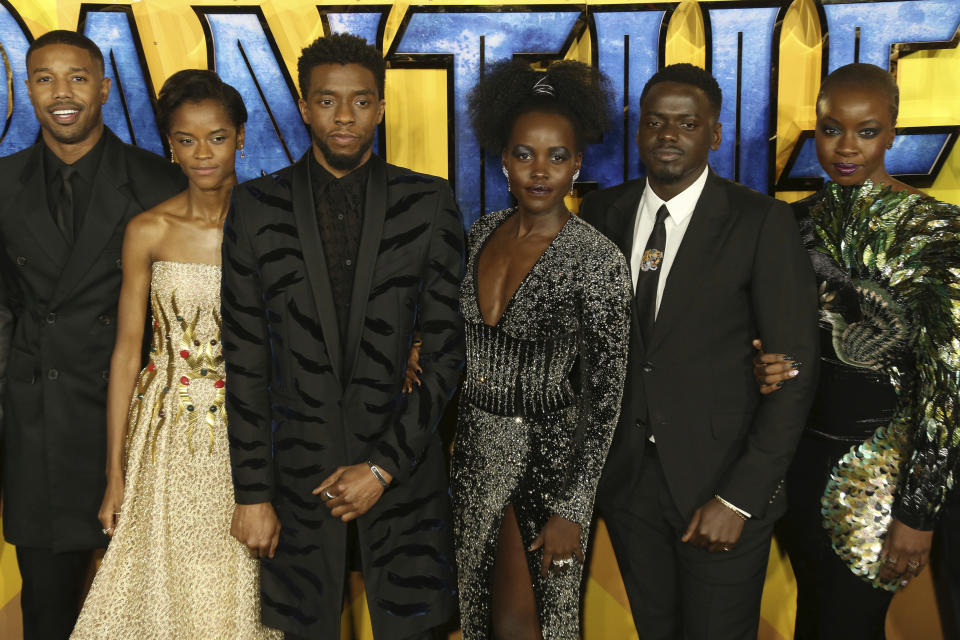 FILE - In this Feb. 8, 2018 file photo, actors Michael B. Jordan, Leitia Wright, Chadwick Boseman, Lupita Nyong'o, Daniel Kaluuya and Danai Gurira pose for photographers upon arrival at the premiere of the film "Black Panther" in London. Boseman, who played Black icons Jackie Robinson and James Brown before finding fame as the regal Black Panther in the Marvel cinematic universe, has died of cancer. His representative says Boseman died Friday, Aug. 28, 2020 in Los Angeles after a four-year battle with colon cancer. He was 43. (Photo by Joel C Ryan/Invision/AP, File)