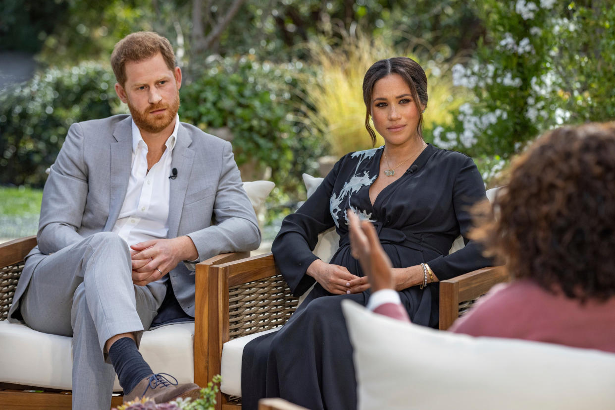 <p>Prince Harry, left, and Meghan, Duchess of Sussex, in conversation with Oprah Winfrey</p> (AP)