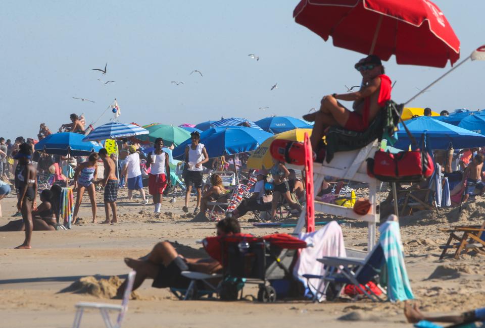 Bathers fill the sands of Rehoboth Beach as sunny weather brought crowds to the Delaware beaches, Saturday, August 21, 2022.