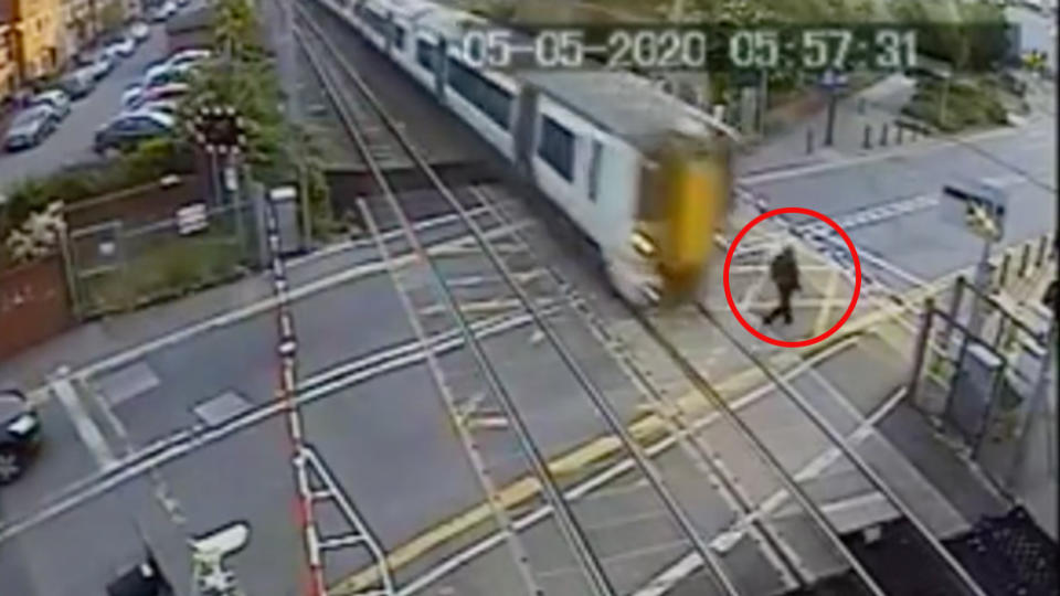 Shocking video shows man’s very close call with train. Source: British Transport Police via Storyful