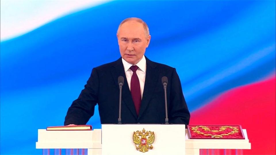 Vladimir Putin takes the oath at his inauguration. (via REUTERS)