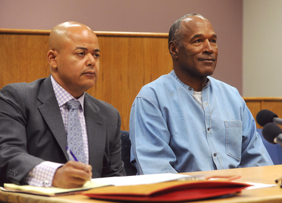 <p>Former NFL football star O.J. Simpson appears with his attorney, Malcolm LaVergne, left, via video for his parole hearing at the Lovelock Correctional Center in Lovelock, Nev., on Thursday, July 20, 2017. Simpson was convicted in 2008 of enlisting some men he barely knew, including two who had guns, to retrieve from two sports collectibles sellers some items that Simpson said were stolen from him a decade earlier. (Jason Bean/The Reno Gazette-Journal via AP, Pool) </p>