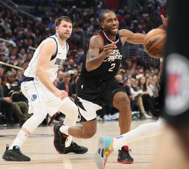 Los Angeles, CA, Tuesday, April 23, 2024 - LA Clippers forward Kawhi Leonard (2) loses control of the ball while guarded by Dallas Mavericks guard Luka Doncic (77) in game two of the NBA Western Conference playoffs at Crypto.Com Arena. (Robert Gauthier/Los Angeles Times)