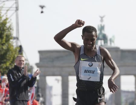 Kenenisa Bekele of Ethiopia celebrates winning the men's competition at the Berlin marathon in Berlin, Germany, September 25, 2016. REUTERS/Fabrizio Bensch