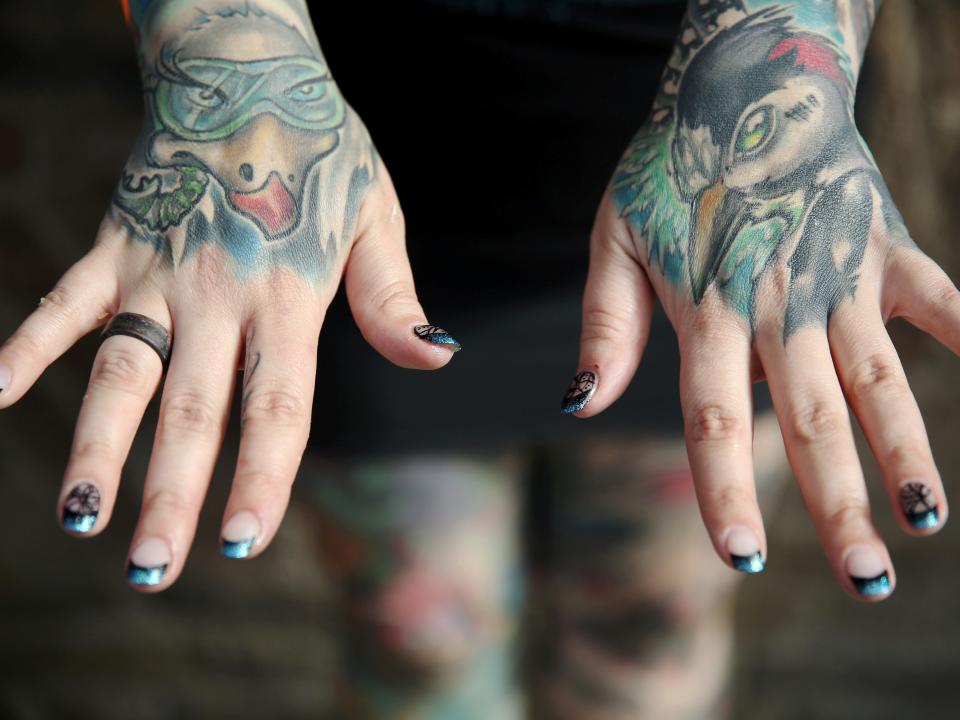 FILE PHOTO: A tattoo enthusiast poses at the International London Tattoo Convention in London, Britain September 23, 2016. REUTERS/Neil Hall/File Photo