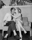 <p>Before boarding the plane to their English honeymoon, the newlyweds share a kiss at New York's Idlewild Airport.</p>