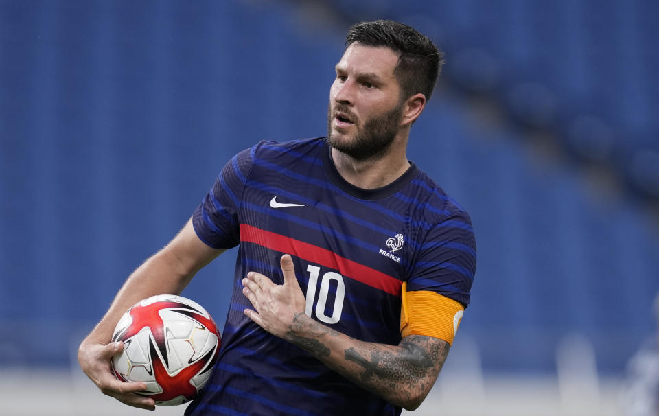 France's Andre-Pierre Gignac celebrates after scoring a goal during a men's soccer match against South Africa at the 2020 Summer Olympics, Sunday, July 25, 2021, in Saitama, Japan. (AP Photo/Martin Mejia)