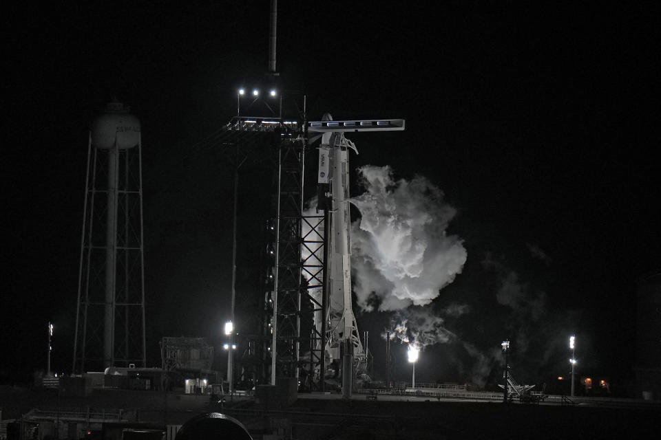 Fuel vents from a SpaceX Falcon 9 rocket as she sits on Launch Complex 39-A Monday, Feb. 27, 2023, after the launch was scrubbed at the Kennedy Space Center in Cape Canaveral, Fla. (AP Photo/Chris O'Meara)