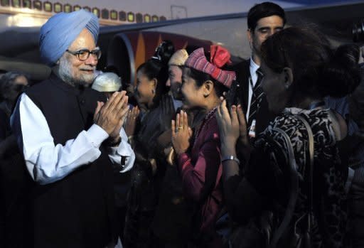 This photo, released by the Indian Press Information Bureau, shows Indian Prime Minister, Dr Manmohan Singh (L) pictured on his arrival at the international airport in Naypyidaw, on May 27. Singh is in Myanmar on a state visit and is the first Indian PM to visit the country in a quarter of a century