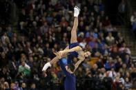 Meagan Duhamel and Eric Radford of Canada compete. REUTERS/Brian Snyder