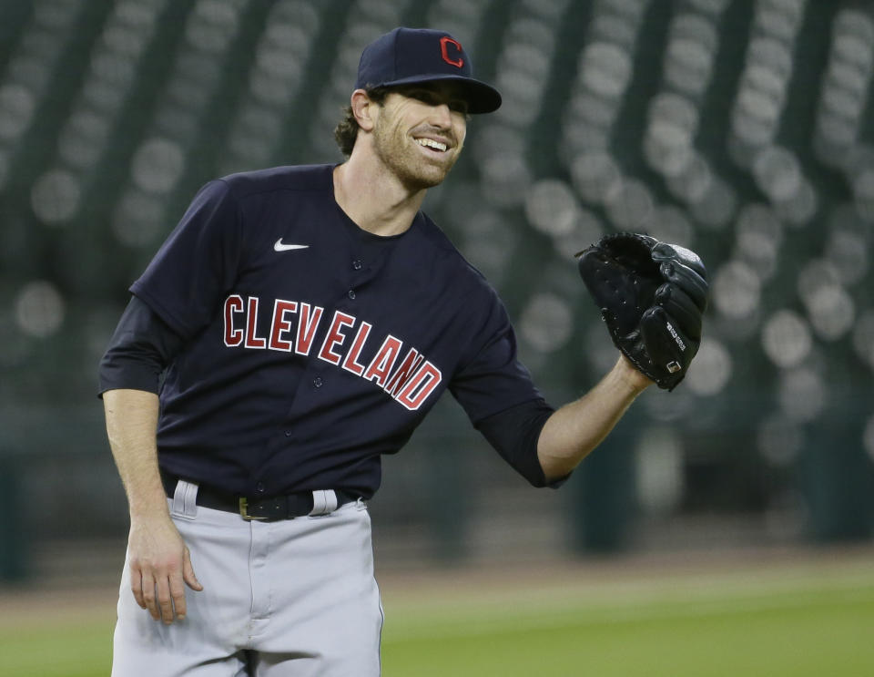 DETROIT, MI -  SEPTEMBER 17:  Starting pitcher Shane Bieber #57 of the Cleveland Indians smiles after trying to pick off Willi Castro of the Detroit Tigers at first base during the fourth inning at Comerica Park on September 17, 2020, in Detroit, Michigan. (Photo by Duane Burleson/Getty Images)