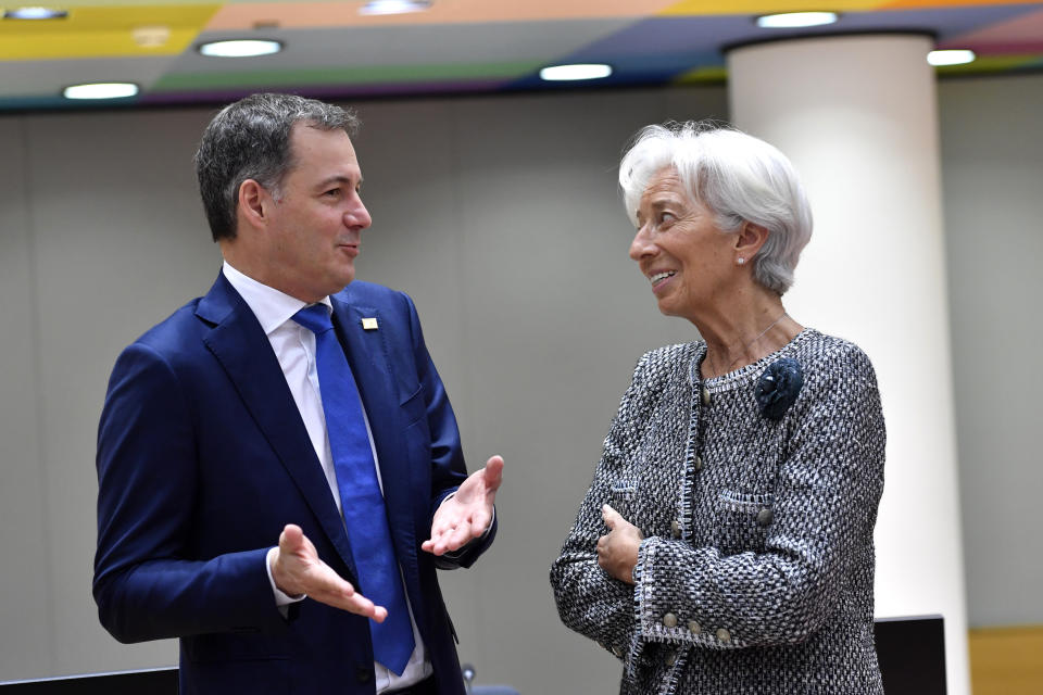 European Central Bank President Christine Lagarde, right, speaks with Belgium's Prime Minister Alexander De Croo during a round table meeting at an EU summit in Brussels, Friday, March 24, 2023. European leaders gather Friday to discuss economic and financial challenges and banking rules, seeking to tamp down concerns about eventual risks for European consumers from banking troubles in the US and Switzerland. (AP Photo/Geert Vanden Wijngaert)