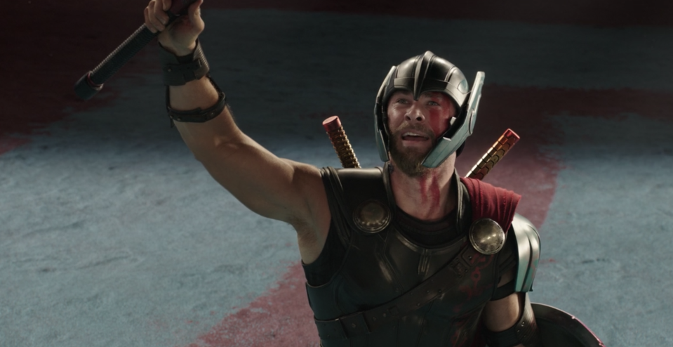 Thor holding up his hammer in a scene from Thor: Ragnarok