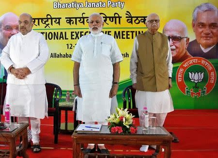 (L-R) Amit Shah, president of India's ruling Bharatiya Janata Party (BJP), Prime Minister Narendra Modi and L.K. Advani, a leader of BJP, sing a patriotic song during the party's national executive meeting in Allahabad, June 12, 2016. REUTERS/Jitendra Prakash