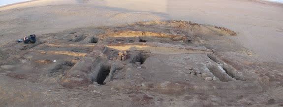 Archaeologists discovered the remains of a toddler in Romano-Christian-period cemetery in Dakhleh Oasis, Egypt, who showed evidence of child abuse. Here, mud bricks for two tomb structures in the cemetery. In the foreground, several excavated g