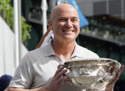FILE - Former Grand Slam champion Andre Agassi poses with the men's Norman Brookes Challenge Cup trophy ahead of the start of Australian Open tennis championships at Melbourne Park, Melbourne, Australia, Sunday, Jan. 14, 2024. At first, Andre Agassi was perplexed by the pickleball craze. He just didn’t get the appeal. Now, the Hall of Fame tennis player can’t get enough of hitting drop shots and charging toward the kitchen. (AP Photo/Andy Wong, File)
