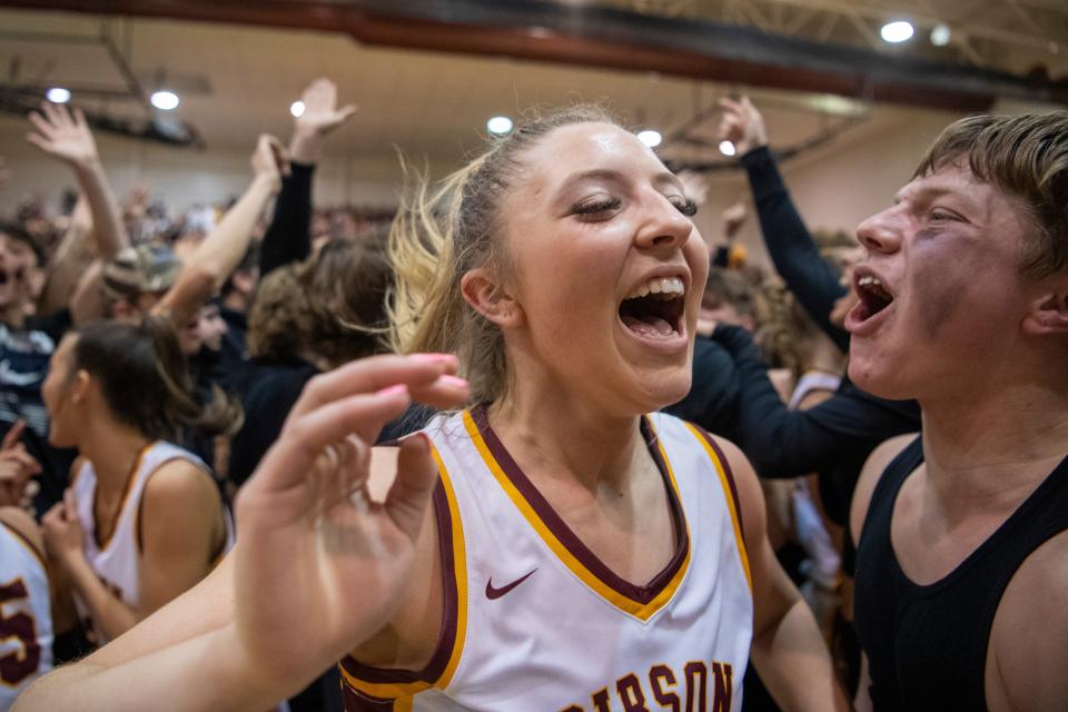 Gibson Southern’s Gabby Spink (15) celebrate after the Titans beat the Memorial Tigers in the semifinal round of the 2024 Class 3A Girls Basketball Sectional 32 at Gibson Southern High School Friday, Feb. 2, 2024.