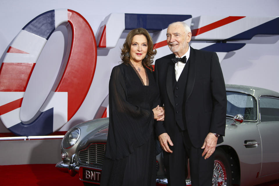 Barbara Broccoli and Michael G. Wilson pose for photographers upon arrival for the World premiere of the new film from the James Bond franchise 'No Time To Die', in London Tuesday, Sept. 28, 2021. (Photo by Joel C Ryan/Invision/AP)