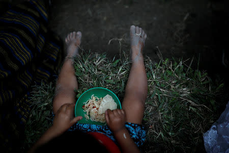 A girl eats lunch at a house in San Antonio Secortez, home village of Jakelin Caal, a 7-year-old girl who died after being detained by U.S. border agents, in San Antonio Secortez, Guatemala December 23, 2018. Picture taken on December 23, 2018. REUTERS/Carlos Barria