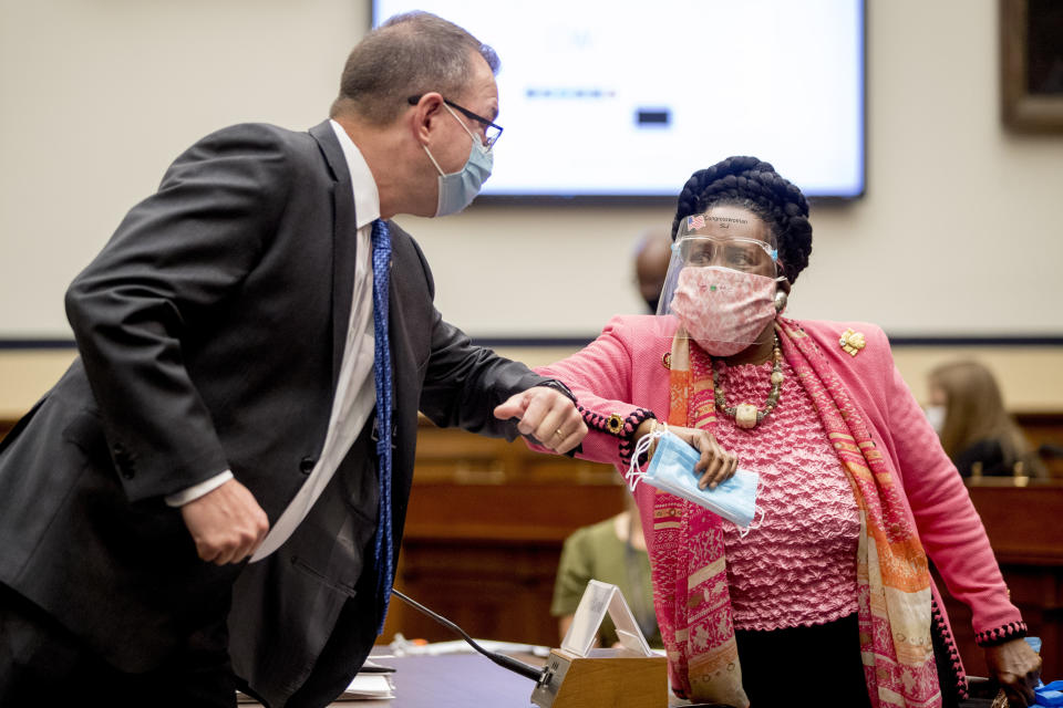 Federal Emergency Management Agency Administrator Peter Gaynor, left, greets Rep. Sheila Jackson Lee, D-Texas, right, as he arrives to testify before a House Committee on Homeland Security meeting on Capitol Hill in Washington, Wednesday, July 22, 2020, on the national response to the coronavirus pandemic. (AP Photo/Andrew Harnik, Pool)