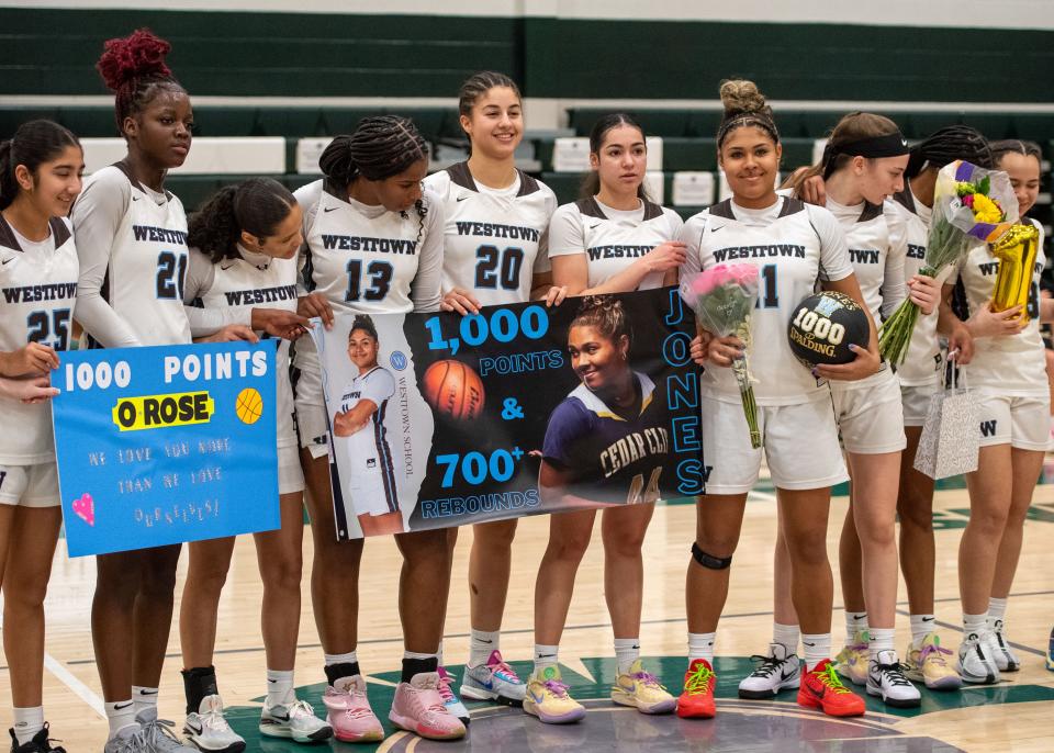 Olivia Jones (11) celebrates with her Westtown teammates after she passed the 1,000-point milestone in Hoops for Harmony at York County Tech on Saturday, Jan. 13, 2023. Most of the points came in two years at Cedar Cliff.