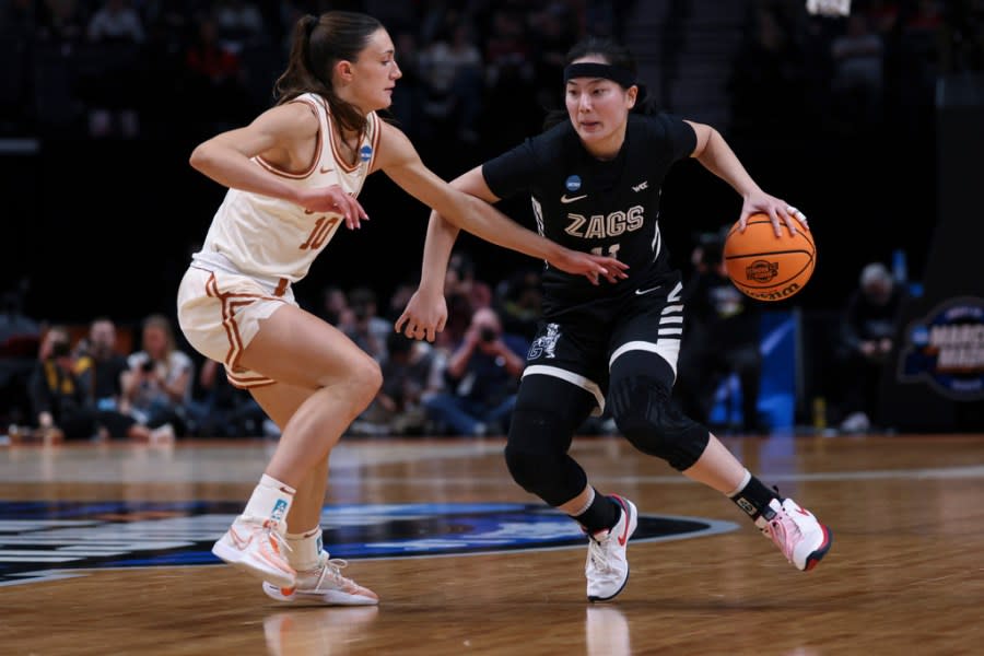 Gonzaga guard Kayleigh Truong (11) tries to get around Texas guard Shay Holle (10) during the first half of a Sweet 16 college basketball game in the women’s NCAA Tournament, Friday, March 29, 2024, in Portland, Ore. (AP Photo/Howard Lao)