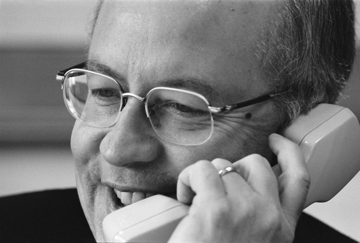 Ken Starr talking on the telephone with great gusto.