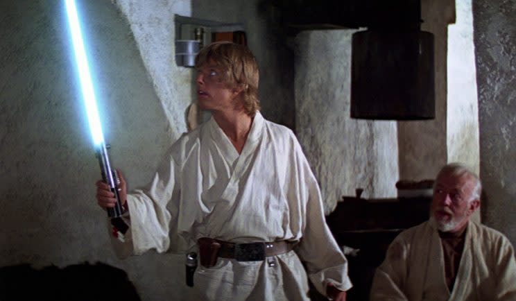 Obi-Wan gives Luke his first lightsaber - Credit: Lucasfilm