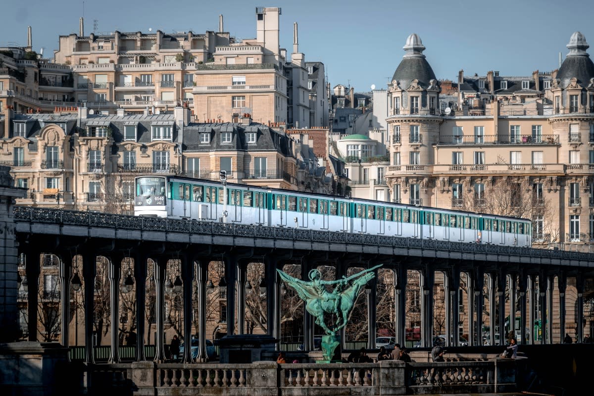 train crossing tracks during the day in Paris, France