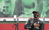 Mercedes driver Lewis Hamilton of Britain after his record breaking 92nd win at the Formula One Portuguese Grand Prix at the Algarve International Circuit in Portimao, Portugal, Sunday, Oct. 25, 2020. (Jose Sena Goulao, Pool via AP)