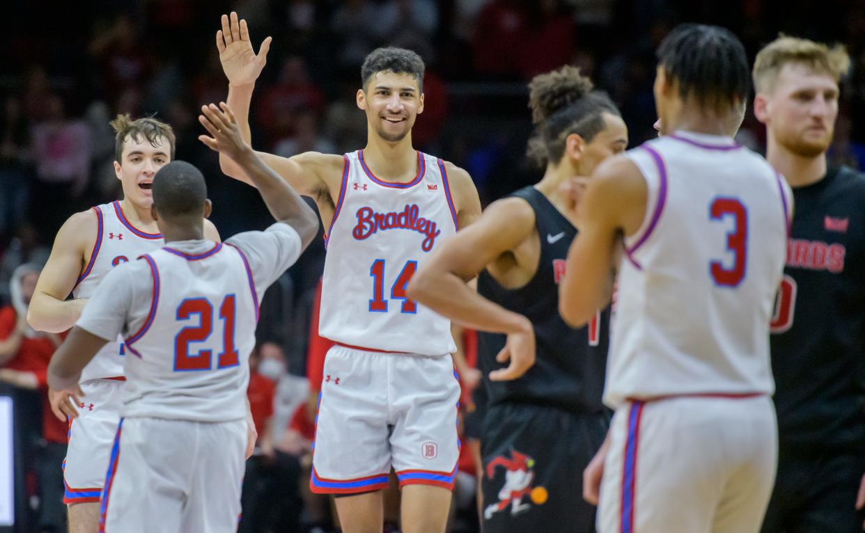 Bradley's Malevy Leons (14) and the Bradley Braves celebrates as they take the lead against Illinois State in the overtime period Wednesday, Jan. 25, 2023 at Carver Arena. The Braves downed the Redbirds 79-75 in overtime.