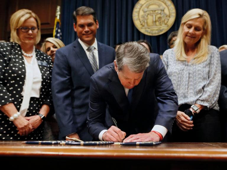 District lawyers in Georgia have announced they will not prosecute women for getting an abortion after the US state effectively banned the procedure.Georgia governor Brian Kemp signed the controversial “heartbeat” abortion ban into law earlier in the month – giving the southern state one of the most restrictive laws in the US.The legislation, which has provoked outrage among women’s rights groups, bans abortion once cardiac activity can be detected in an embryo. This can be as early as six weeks – at which point most women do not yet know they are pregnant. The bill imposes jail sentences for women found guilty of aborting or attempting to abort their pregnancies, with the potential for life imprisonment and the death penalty. It is not scheduled to come into effect until 1 January and is expected to face challenges in the courts – with it potentially being postponed. But anti-abortion activists hope challenges will lead to the US Supreme Court reversing Roe vs Wade – the landmark Supreme Court decision which legalised abortion nationwide in 1973 – especially with new conservative justices Neil Gorsuch and Brett Kavanaugh sitting on the court.The Supreme Court has previously ruled that states cannot ban abortion before a foetus is viable – about 23 to 25 weeks.District prosecutors for Georgia’s four most populous counties – Fulton, Gwinnett, Cobb and DeKalb – have said they would not, or could not, prosecute women under the controversial new law.“As District Attorney with charging discretion, I will not prosecute individuals pursuant to HB 481 [the heartbeat bill] given its ambiguity and constitutional concerns,” DeKalb County district attorney Sherry Boston told The Atlanta Journal-Constitution.“As a woman and mother, I am concerned about the passage and attempted passage of laws such as this one in Georgia, Alabama, and other states.”She added: “There is no language outlined in HB 481 explicitly prohibiting a district attorney from bringing criminal charges against anyone and everyone involved in obtaining and performing what is otherwise currently a legal medical procedure”.According to the publication, the technical language of the bill means that district attorneys could potentially seek a murder charge against someone who breaches the heartbeat law.“As a matter of law (as opposed to politics) this office will not be prosecuting any women under the new law as long as I’m district attorney,” Gwinnett County DA Danny Porter said. He said he did not think it would be possible to prosecute a woman for either murder or unlawful abortion if she got an abortion after six weeks.John Melvin, acting District Attorney of Cobb County, echoed this position, saying women could “absolutely not” be prosecuted under the unlawful abortion statute.Fulton County district attorney Paul Howard “has no intention of ever prosecuting a woman under this new law", a spokesperson said, adding that he also would not prosecute abortion providers.Georgia’s new bill does include exceptions for cases involving rape, incest, or in situations where the health of a mother is in danger.“Planned Parenthood will be suing the State of Georgia. We will fight this terrible bill because this is about our patients’ lives,” Dr Leana Wen, president of Planned Parenthood Action Fund, said.Georgia’s bill comes after Alabama Governor Kay Ivey signed a controversial abortion bill into law last week that is the most restrictive abortion bill in the US.Under the law, doctors would face 10 years in prison for attempting to terminate a pregnancy and 99 years for carrying out the procedure. The abortion ban, which has been branded a “death sentence for women”, would even criminalise performing abortions in cases of rape and incest. Ms Ivey said the new law might be “unenforceable” due to Roe v Wade but said the new law was passed with the aim of challenging that decision.Alabama state lawmakers compare abortions in America to the Holocaust and other modern genocides in the legislation – spurring Jewish activists and abortion rights groups to rebuke the bill as “deeply offensive.”Alabama’s new bill comes as politicians in several other states propose legislation to restrict abortion – with some 16 other states looking at new measures.More than a dozen other states have passed or are considering versions of Georgia’s law. Kentucky, Mississippi and Ohio have also approved bans on abortion once a foetal heartbeat is detected. On Friday, Missouri lawmakers passed a bill banning abortions after eight weeks.Groups such as the American Civil Liberties Union of Georgia vowed to sue on the day the governor signed Georgia’s heartbeat bill. It has also fuelled many in the entertainment industry to threaten to boycott Georgia.“We’re putting lawmakers on notice: Your votes are far outside the mainstream, and we will now spend our time and energy launching a campaign to replace you,” Staci Fox, the president and CEO of Planned Parenthood Southeast, said at the time.A federal judge blocked a heartbeat bill in Kentucky which was scheduled to come into effect instantly as it could be unconstitutional, while Mississippi passed a six-week abortion law in March that is not due to come into force until July and is also facing challenges.Ohio passed a similarly restrictive law in 2016 which was vetoed by the governor.