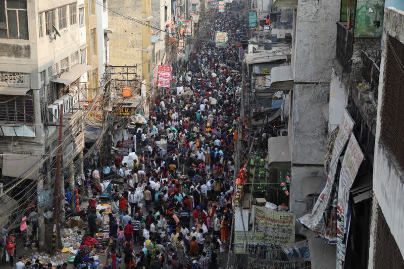 Shoppers crowd a market on the occasion of the Hindu festival of Diwali, amidst the spread of the coronavirus disease (COVID-19), in the old quarters of Delhi