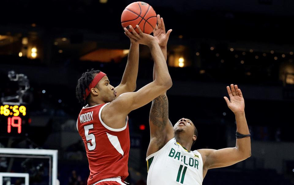 Moses Moody #5 of the Arkansas Razorbacks shoots over Mark Vital #11 of the Baylor Bears during the second half in the Elite Eight round of the 2021 NCAA Men's Basketball Tournament at Lucas Oil Stadium.