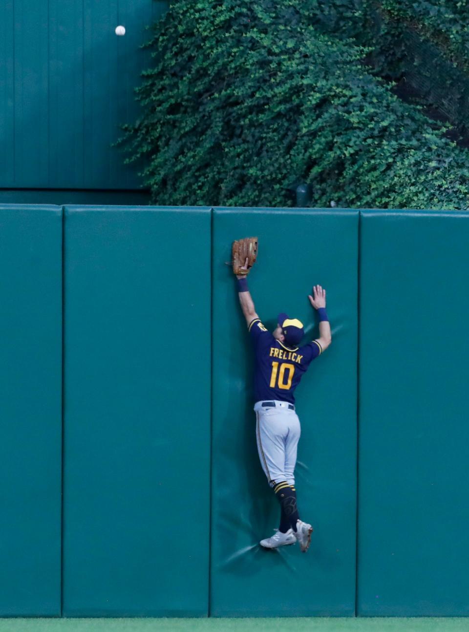 Brewers center tfielder Sal Frelick leaps for a ball hit by the Pirates' Jack Suwinski for a two-run home run during the fourth inning Monday night at PNC Park.