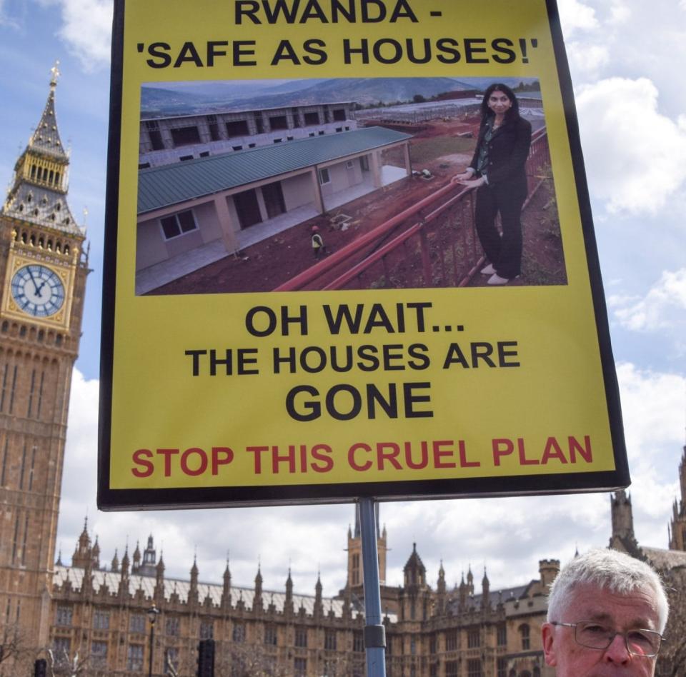 A man protests against the Rwanda scheme outside Parliament this week