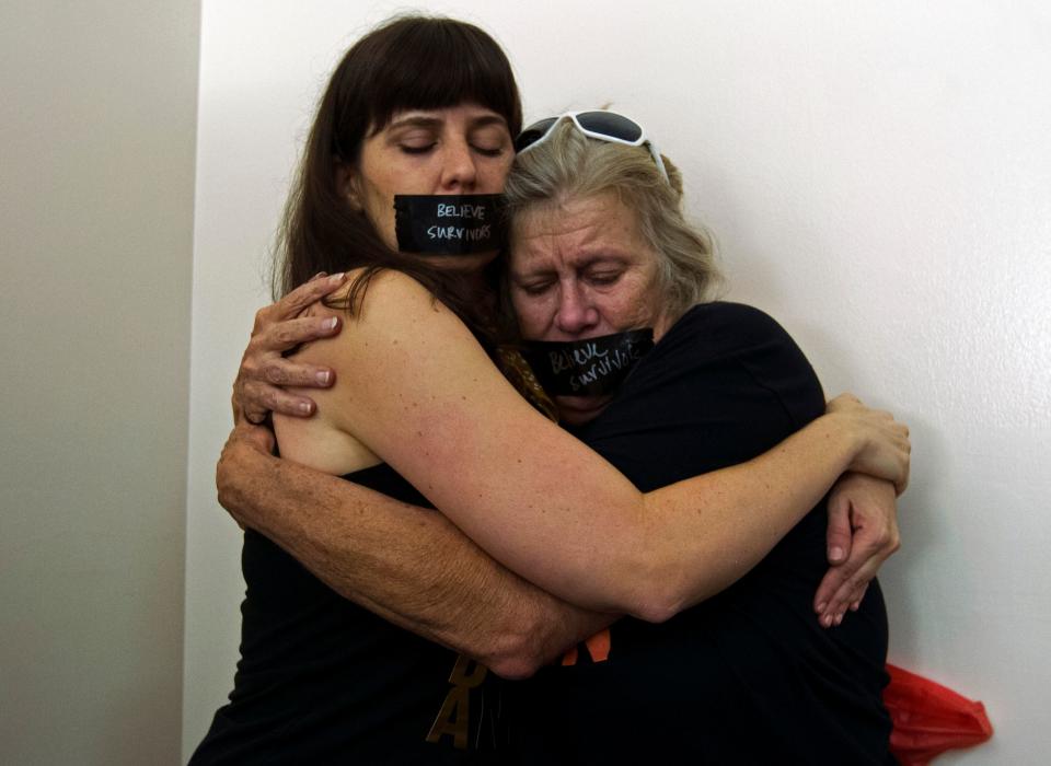 At times, demonstrators became emotional as they protested Kavanaugh's nomination outside of last week's hearing in Washington D.C. (JOSE LUIS MAGANA via Getty Images)