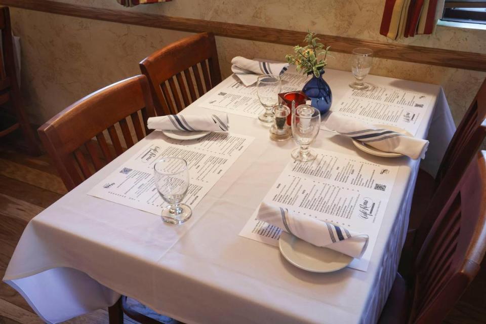 Café Roma brought back old-style table settings that use the menus as placemats, seen here on Nov. 30, 2023.
