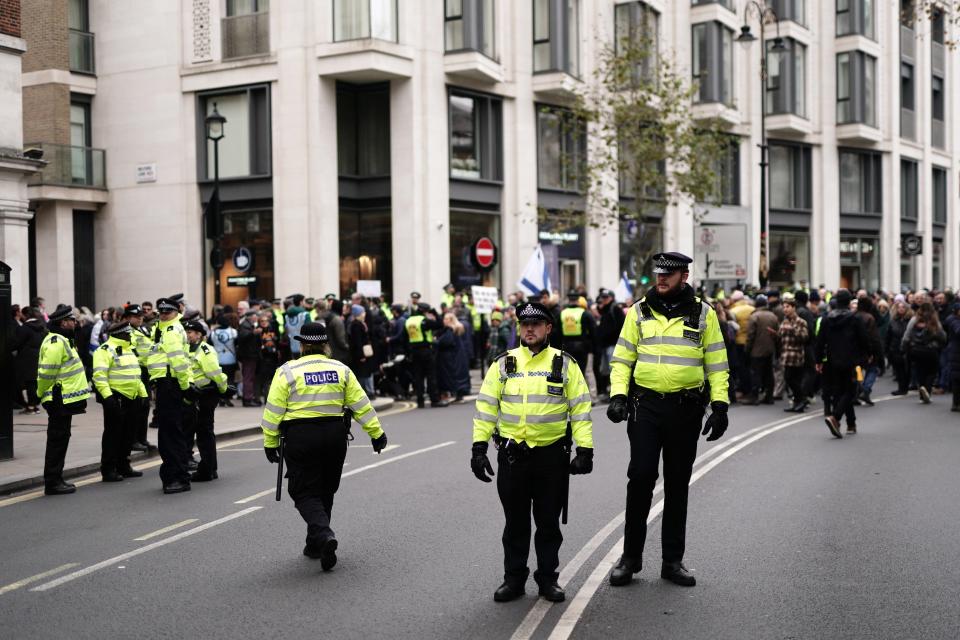 Police officers take part in a march against antisemitism at the Royal Courts of Justice in London organized by the volunteer-led charity Campaign Against Antisemitism (Jordan Pettitt/PA Wire)