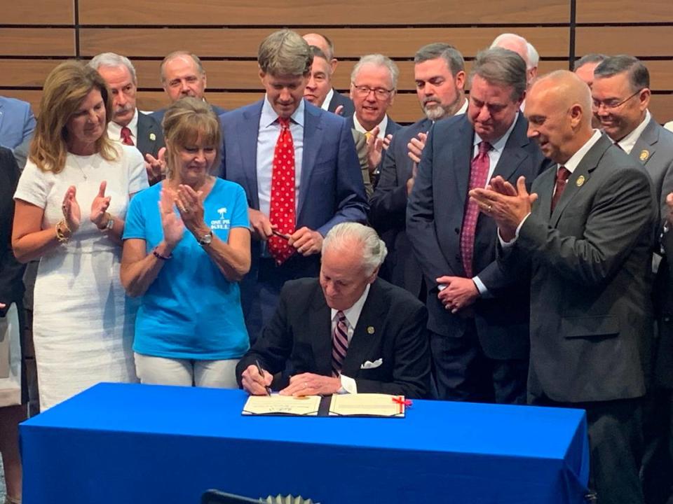 South Carolina Gov. Henry McMaster signs a law that orders prison time for possessing and trafficking fentanyl on Tuesday, Aug. 1, 2023 at the State Law Enforcement Division lab.