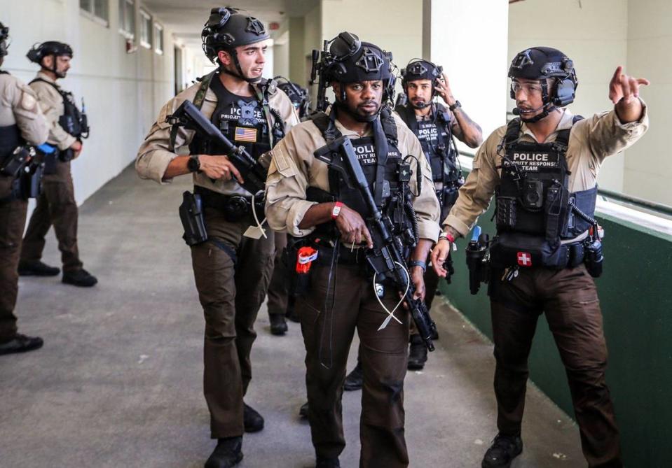 Miami-Dade Police officers arrive on the scene during a large-scale active shooter drill at Miami Central Senior High in Miami, Florida on Thursday, July 18, 2024.