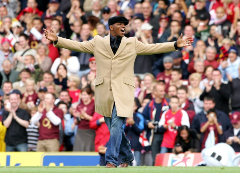 Former Arsenal player Ian Wright acknowledges the fans before the Premier League match between his former side and Manchester United at Arsenal's then ground at Highbury, north London on October 22, 2005