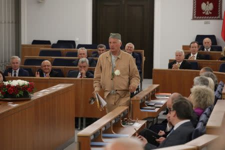 Senator Jan Rulewski dressed as a prisoner attends a senate session at the Polish parliament in Warsaw, Poland, July 21, 2017. Agencja Gazeta/Slawomir Kaminski via REUTERS