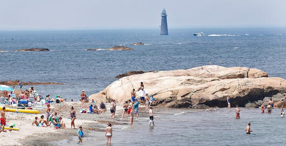 Beachgoers fill Minot Beach in Scituate at high tide on Friday, July 1, 2022.