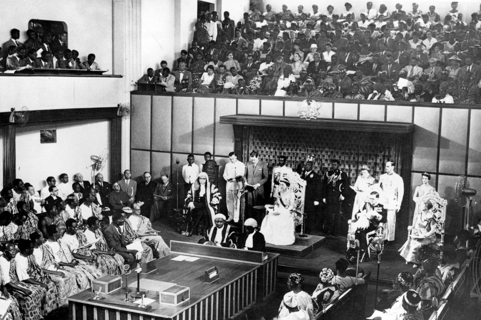 The Duchess of Kent, seated center on dais, reads a message from the Queen of England in the Parliament House at Accra, Ghana, on March 6, 1957. Ghana, the British colony known as the Gold Coast, is the first black African nation to gain independence from colonial rule. Seated at right is the Governor General Sir Charles Noble Arden-Clarke and at far right is Lady Arden-Clarke. (AP Photo)